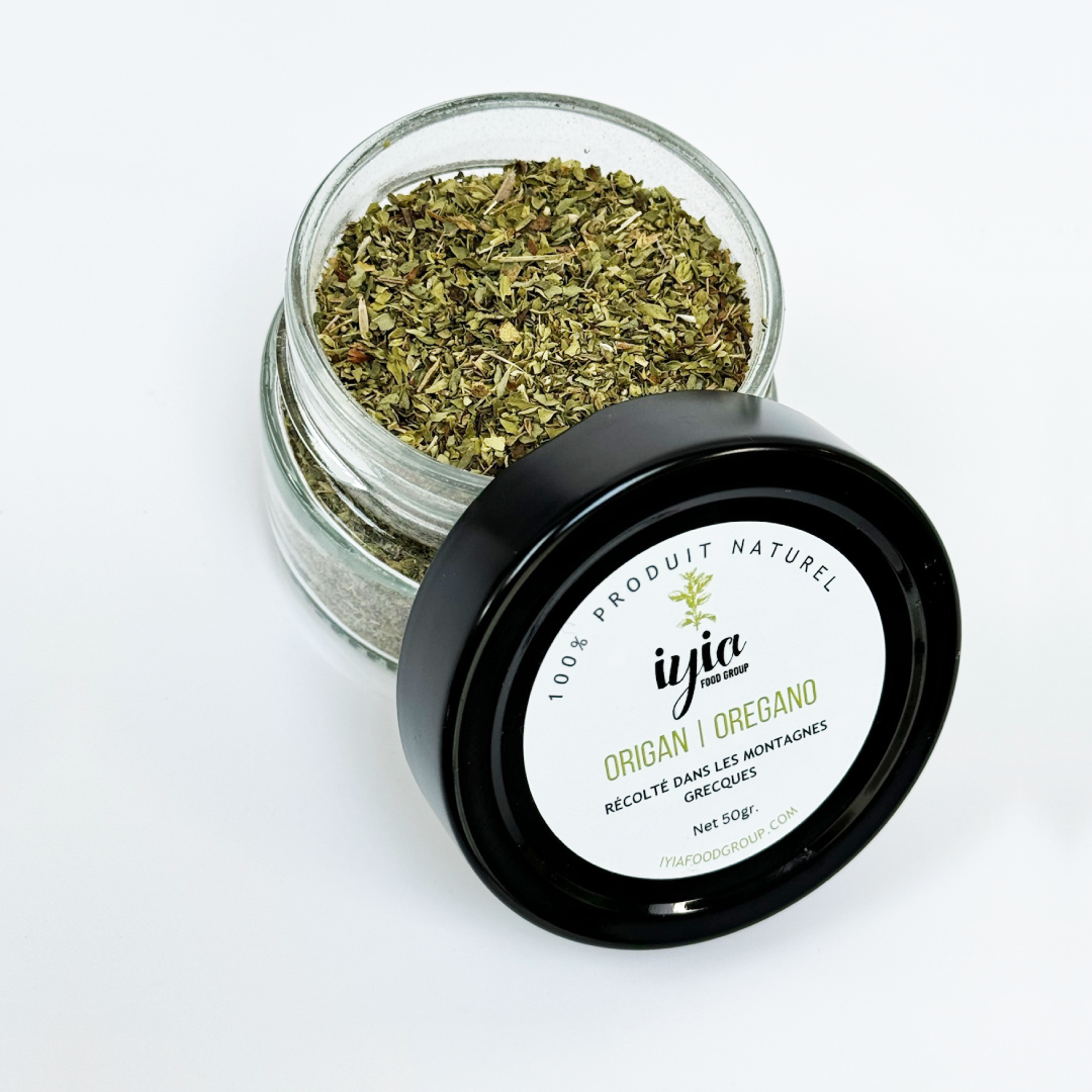 Close-up of dried oregano inside a 50g glass jar. Aromatic and flavorful seasoning for various dishes